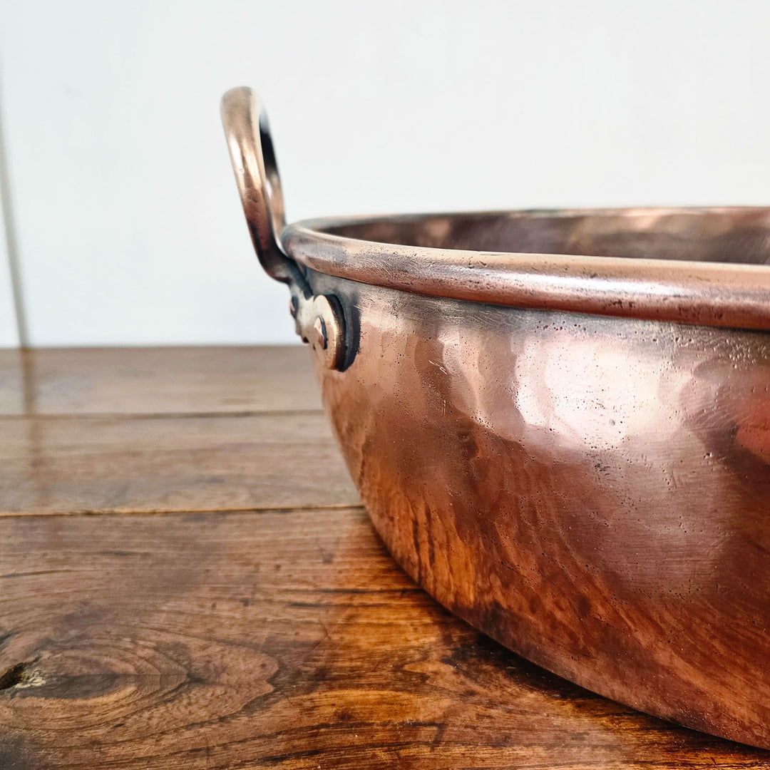 Rustic copper cookware, antique charm for modern kitchens.
