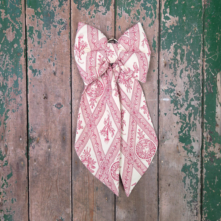 Handmade decorative bow from the Country House range, created in limited numbers using genuine vintage materials. Designed with a structured, padded body and brass hanging hoop, it adds a soft, elegant touch to farmhouse interiors, bedrooms, or dressing room doors.