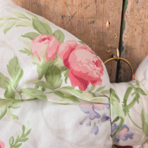 Handmade decorative bow from the Jennings & Cox Country House collection, crafted in vintage Sanderson Roses & Lilacs fabric. Structured with a padded body and tapering tails, each bow is unique, finished with a brass ring, and limited to three in total.