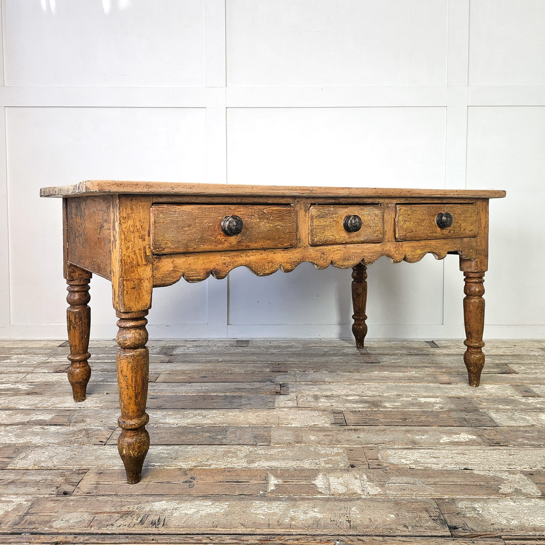 Rustic pine kitchen table with drawer fronts
