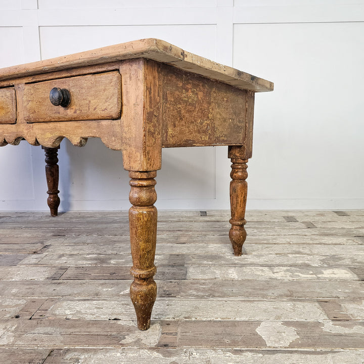 Antique table with rustic patina and storage
