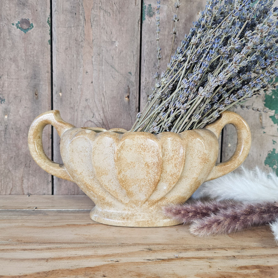 Brown and cream mottled glaze vase
Stoneware vase with scalloped edge
