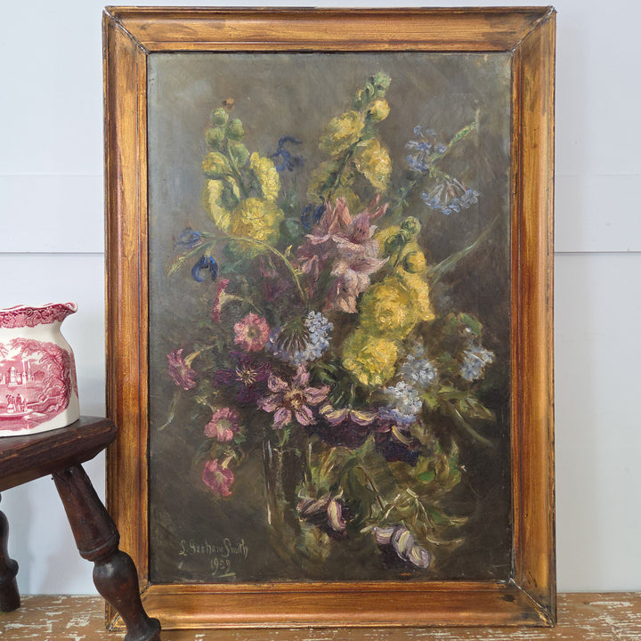1929 floral oil painting by Canadian artist L Graham Smith. Shows a colourful bouquet of garden flowers on canvas, finished with a painted gilt frame. An authentic antique impressionist piece.
