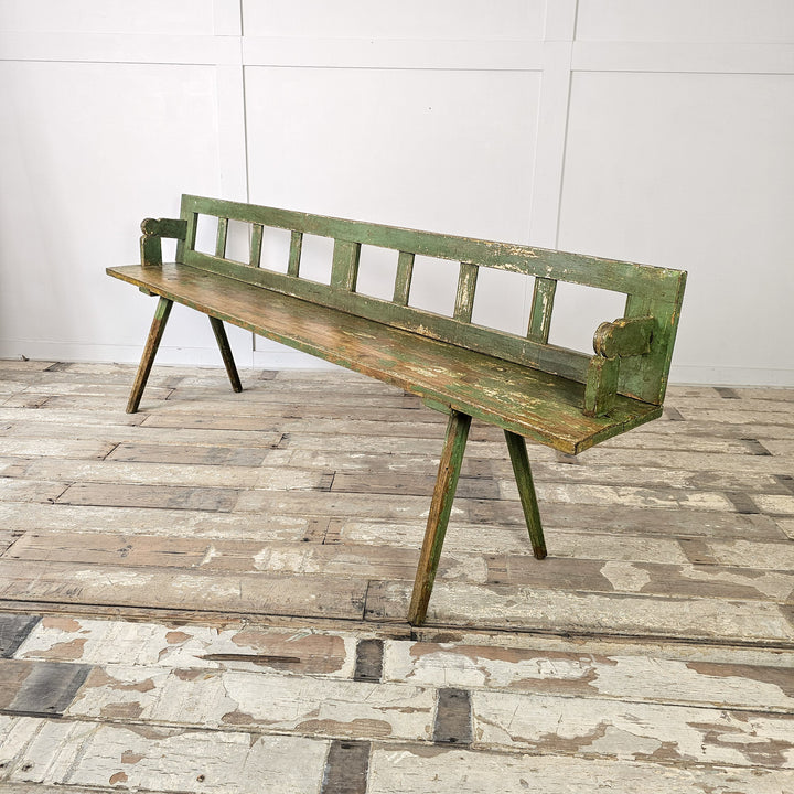 Primitive church bench in pine with splayed legs
