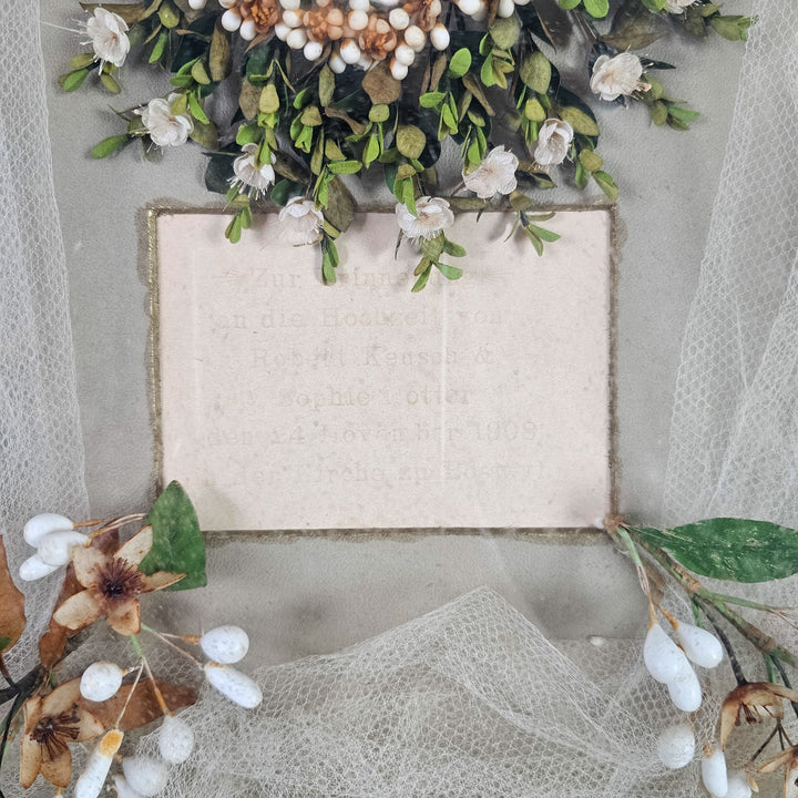 Antique wedding crown and veil display in gilt frame
