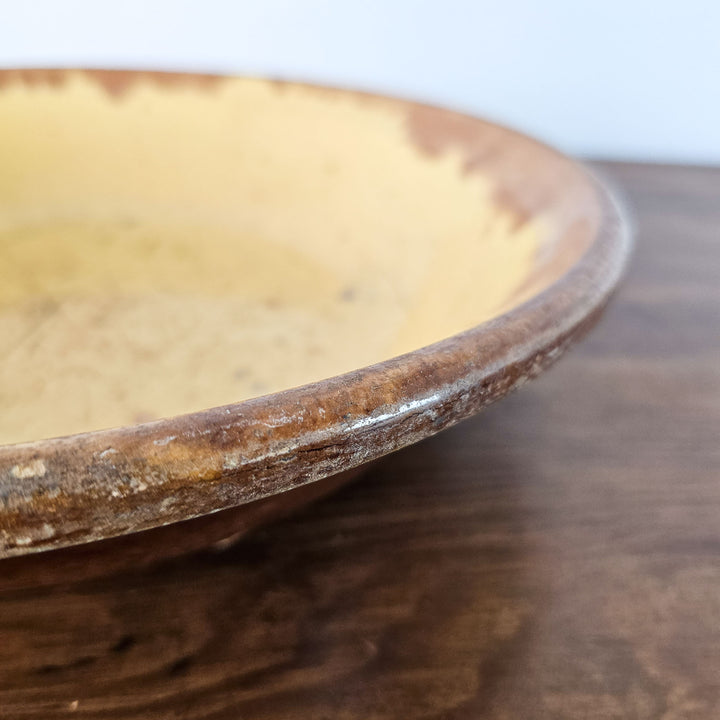 Antique dairy bowl with distinctive maker's mark, perfect for kitchen or hallway décor