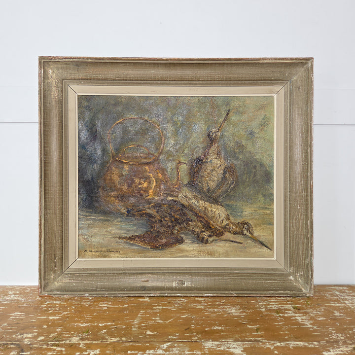 A 20th century vintage French still life oil painting signed by Marcelle Macqueron-Thompson. The artwork depicts a trio of game birds beside a copper kettle, painted with textured detail. Presented in a decorative wooden frame, this original piece is ready to hang.