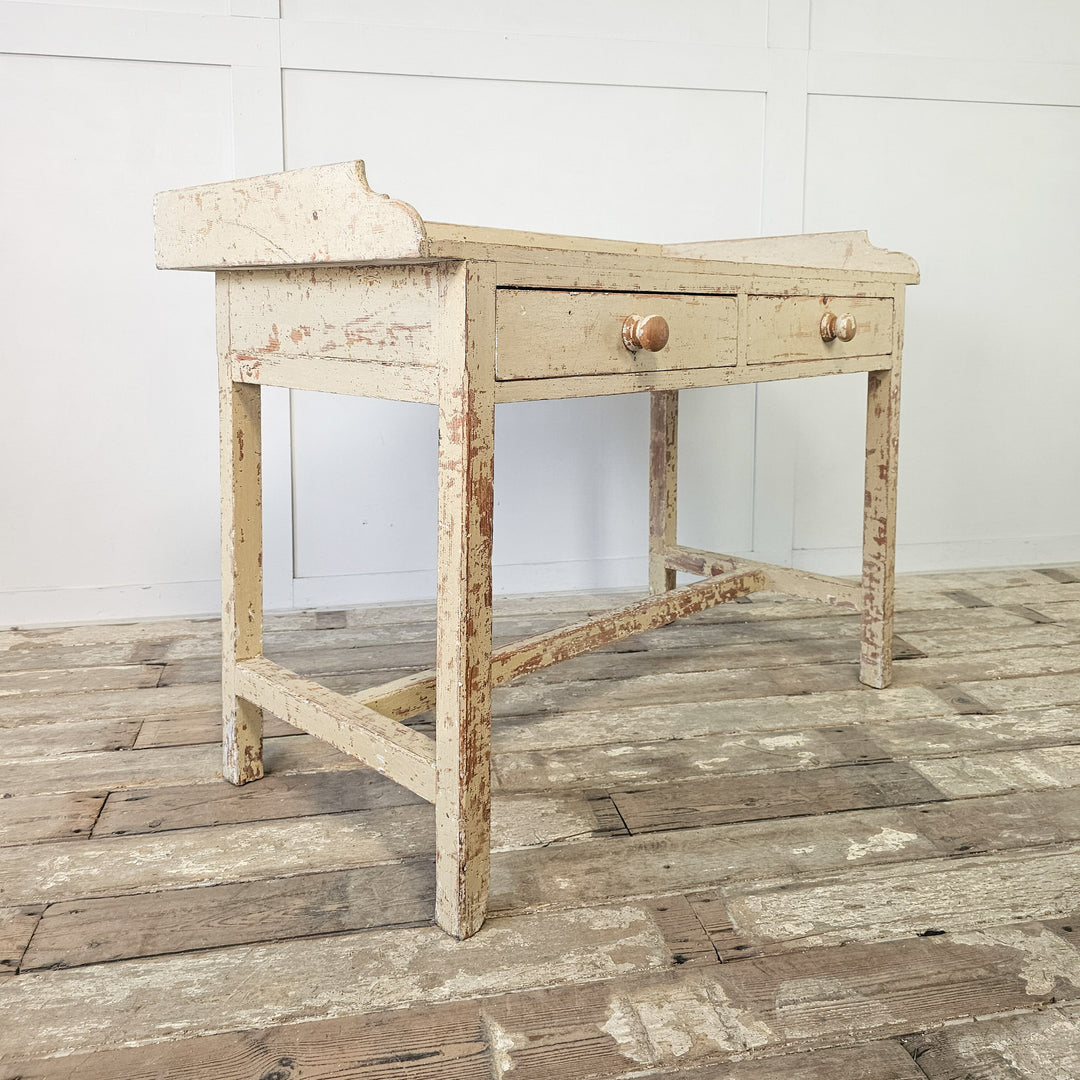 Antique table with gallery back and wooden knobs