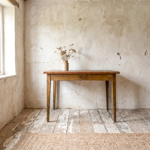 Antique French worktable with mustard yellow painted base and original linen-covered top on four slender tapering legs