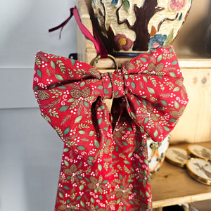 Brass and velvet adorned festive bow for holiday decor
