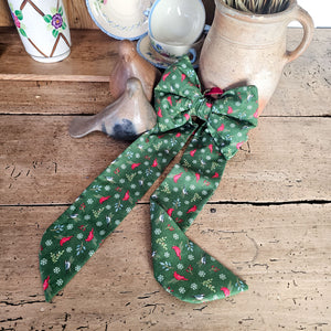 Festive patterned handmade bow with velvet ribbon.
