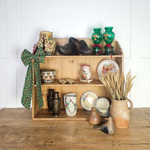 Decorative bow with festive design for holiday decor.
