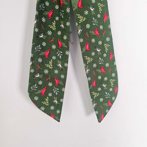 Handcrafted bow with brass ring for wall hanging.
