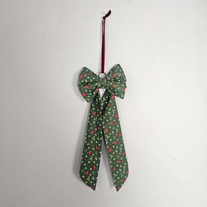 Festive handmade bow suitable for tree or wreath decoration.
