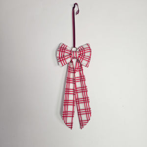 Brass ringed festive bow with handmade craftsmanship.
