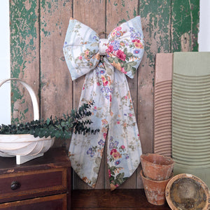 Handmade Country House Bow designed from genuine vintage floral stripe fabric with a structured padded body and gently tapering tails. Each bow is unique and finished with a brass hanging ring, suitable for home styling, seasonal decoration, or as a thoughtful gift piece.