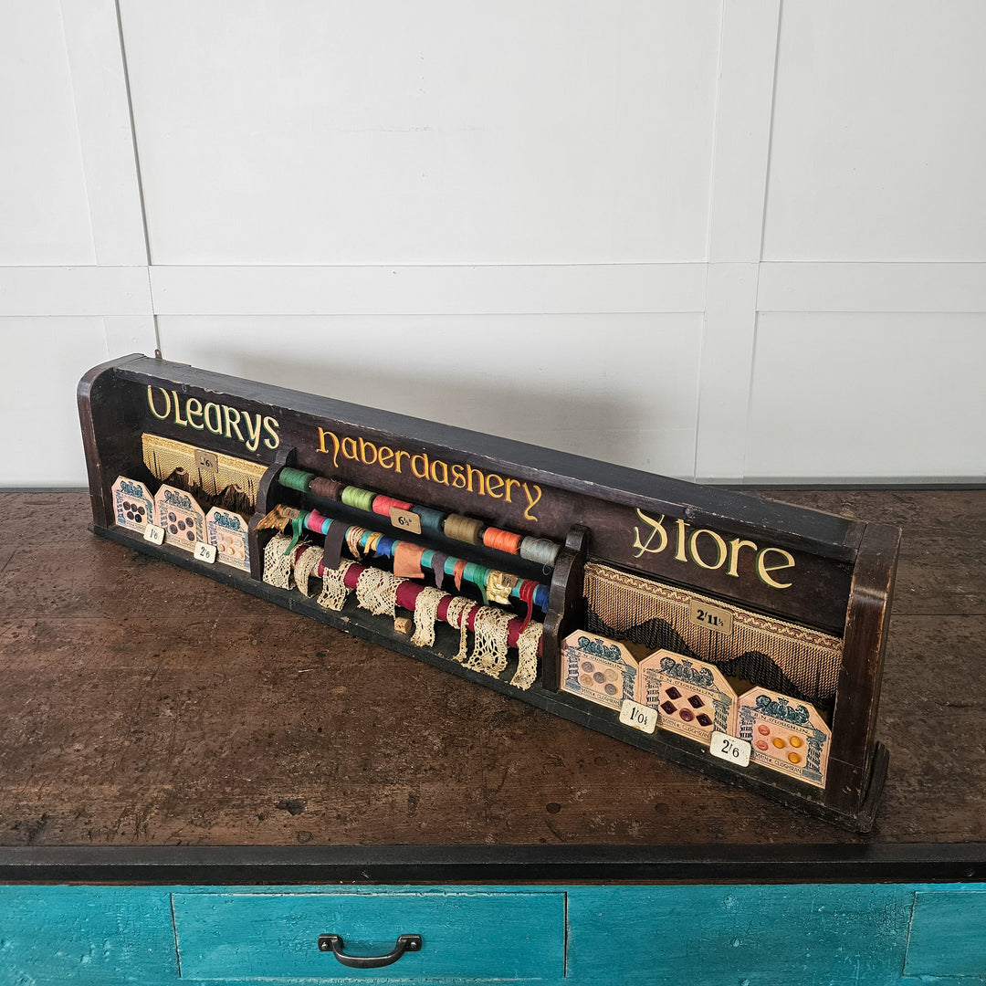 Early 1900s shop display with buttons, ribbon and thread
