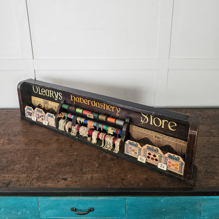Early 1900s shop display with buttons, ribbon and thread
