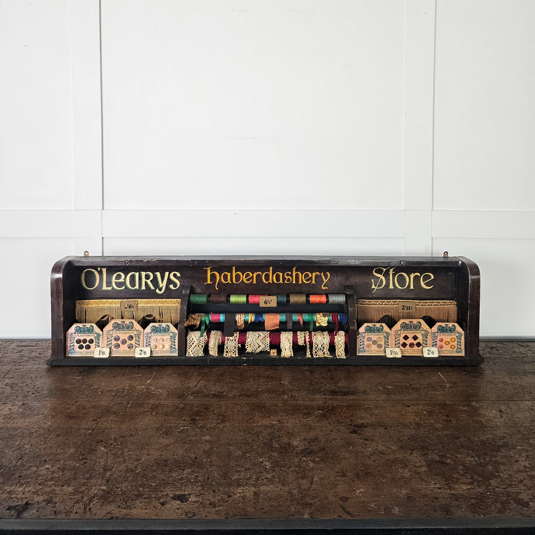 Antique retail display with sewing trims and original pricing
