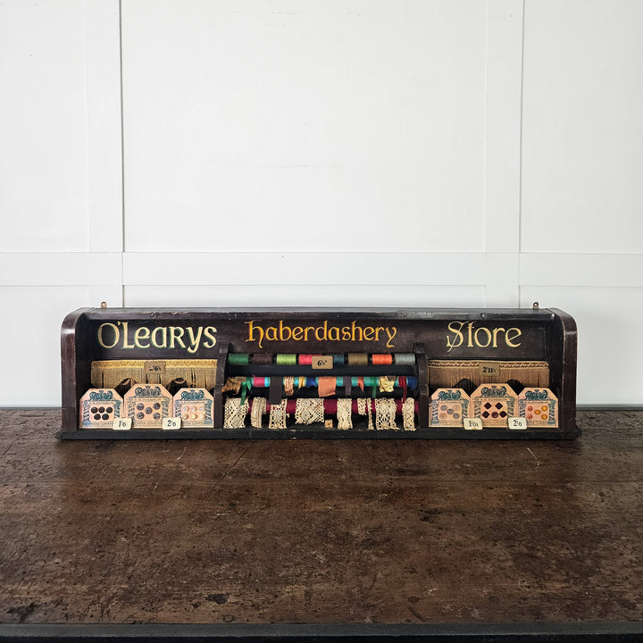 Antique retail display with sewing trims and original pricing
