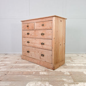 A rustic Victorian pine chest of drawers from the 19th century, built with five drawers and finished in stripped pine. This storage chest can be used as bedroom drawers or positioned along a wall as a sideboard.