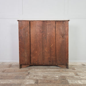A Victorian pine chest of drawers with five drawers arranged in a two-over-three formation and finished in stripped pine. This farmhouse style storage chest is suitable for bedroom use or placed in a hallway.