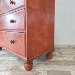 Antique Victorian painted pine chest of drawers with red paintwork, fitted with wooden knobs. Five drawers with graduating depths, raised on bun feet. A practical and decorative antique chest for farmhouse interiors and country home styling.