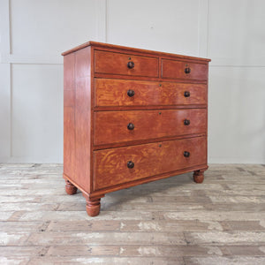 Antique Victorian pine chest of drawers featuring five drawers in two over three layout, complete with original wooden knobs. Retains its authentic red painted finish, raised on bun feet. Perfect as antique bedroom drawers, hallway storage or farmhouse sideboard.
