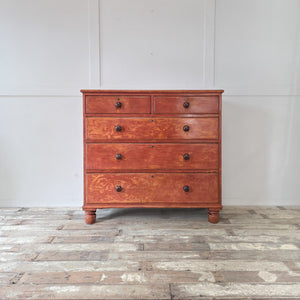 Large Victorian painted pine chest of drawers with substantial proportions and five spacious drawers. Retains its red paintwork, fitted with wooden knobs and raised on bun feet. An antique storage chest ideal for bedroom clothes, linens, or hallway household essentials.