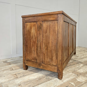 Early 20th-century antique pine storage chest with a hinged lid, panelled sides and two interior compartments. Finished in wax to deepen the pine colour, this solid wooden trunk has a country house and cottage style character, offering generous, well-organised storage suitable for linens, bedding or household pieces.
