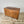 Antique pine chest with block feet, hinged top and spacious two-part interior for linens or toys
