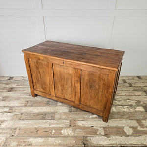 Antique pine chest with block feet, hinged top and spacious two-part interior for linens or toys
