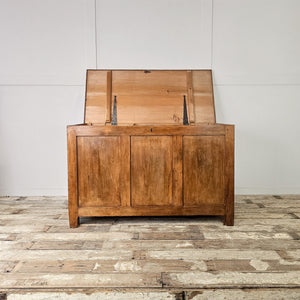 Vintage storage trunk for linens or toys, with large capacity and divided pine interior for practical use in any room.
