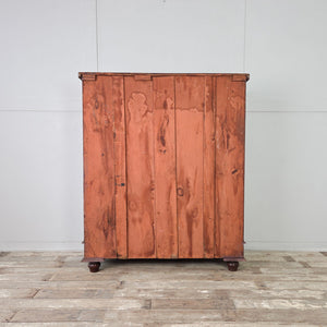 Substantial five-drawer walnut chest of drawers standing on robust original bun feet.
