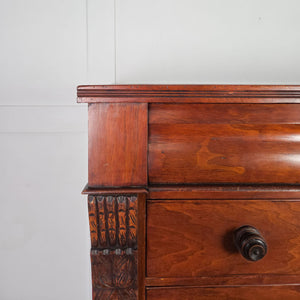 Victorian walnut chest of drawers featuring a hidden secret drawer and original wooden handles.

