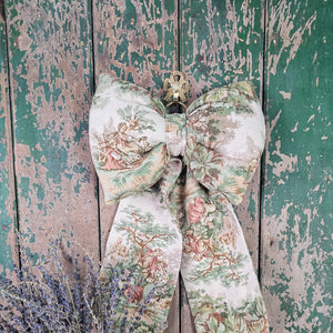 Rustic hanging bow made from vintage fabric

