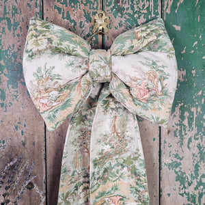 Statement bow with muted green and pink palette
