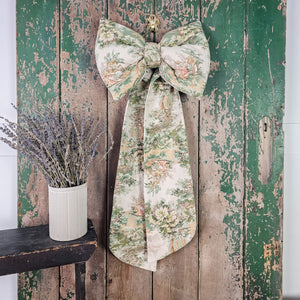 Artisan-made bow with period-style illustration