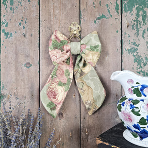 Handmade bow featuring vintage floral material
