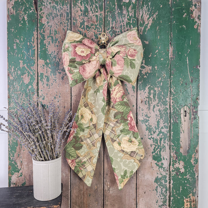 Fabric bow with antiqued brass ring detail