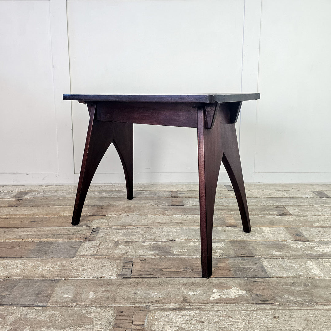 "Vintage mahogany side table with protective wax finish."
