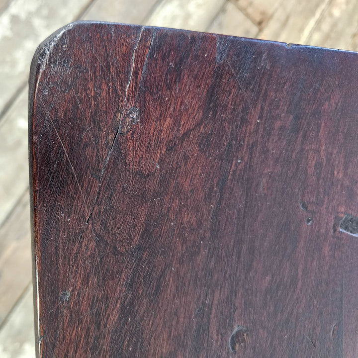 "Arched base mahogany side table from the 20th century."
