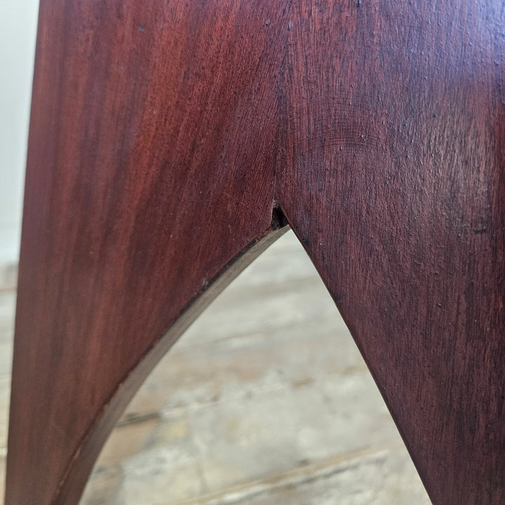 "Rectangular top mahogany table with cut-out base."
