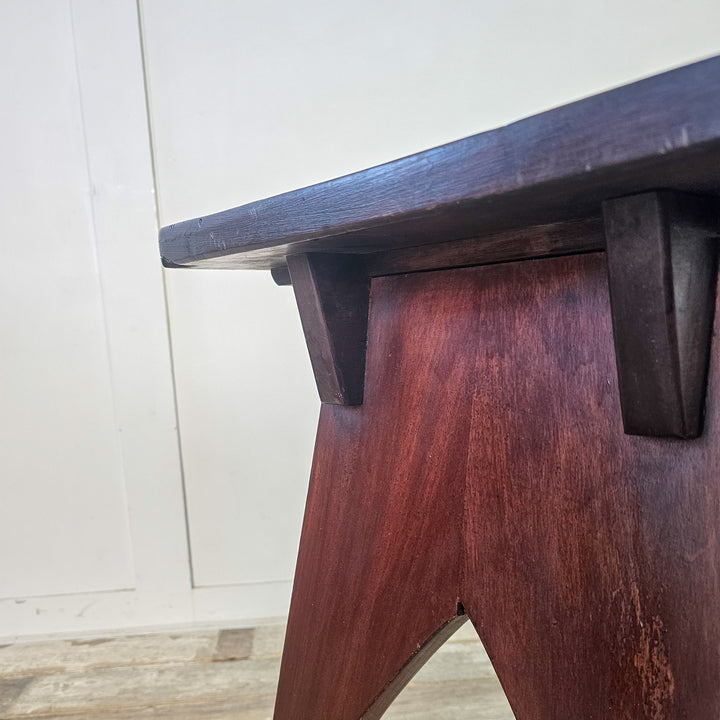"Rectangular top mahogany table with cut-out base."

