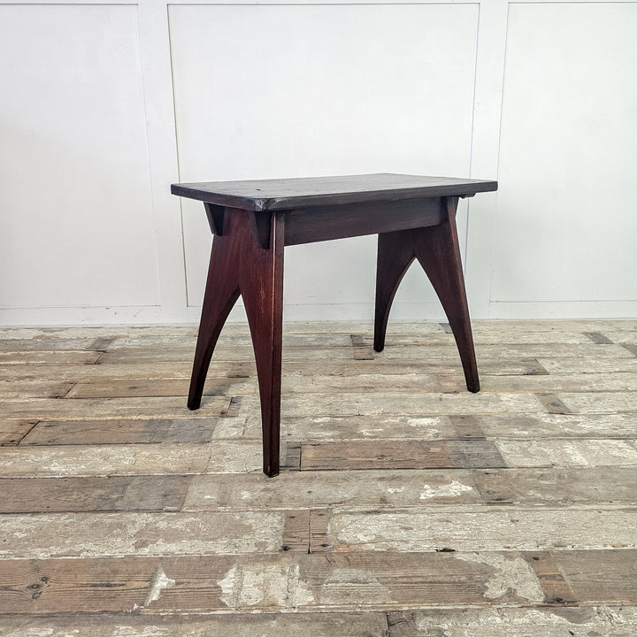 "Contemporary mahogany side table with rounded edges."
