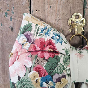 Decorative floral bow with soft cushioned body and classic tapered tails