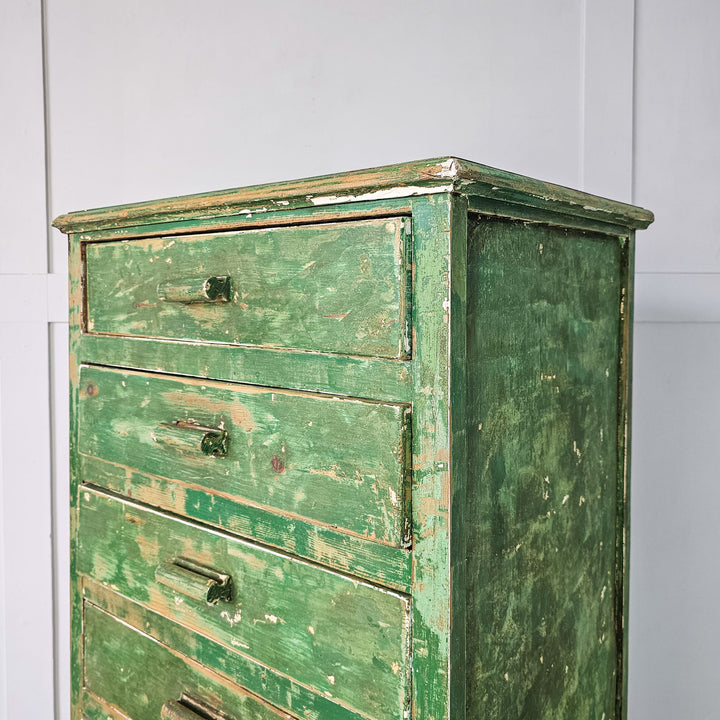 Functional and stylish: 1930s cabinet in green paint, raised on straight legs, offering ample storage in its eight drawers.