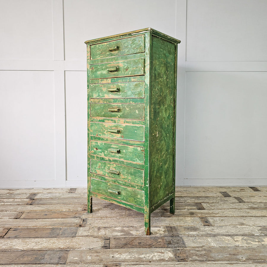 Vintage 1930's Cabinet with 8 Drawers: A green-painted wooden cabinet with eight drawers, standing on straight legs.