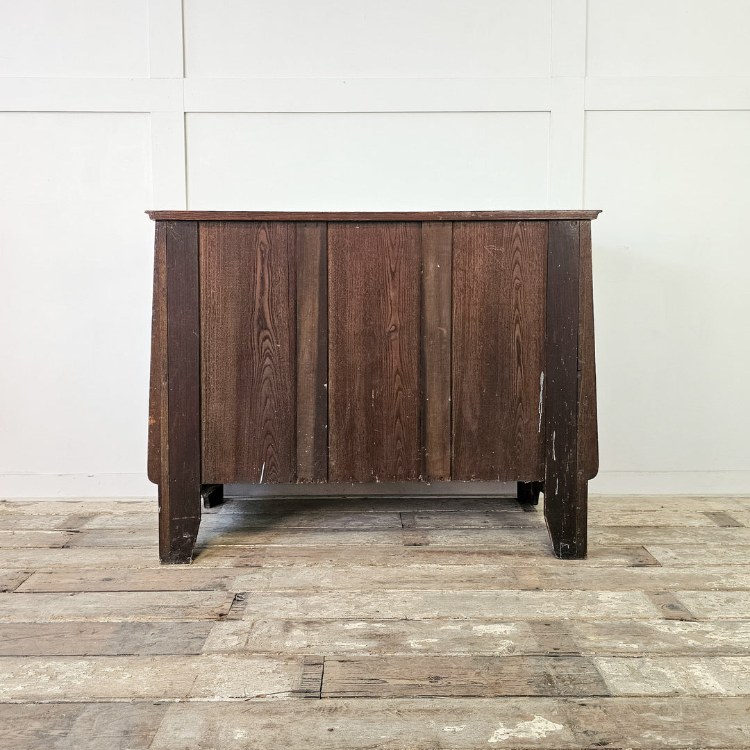 Four-drawer oak chest with traditional form
