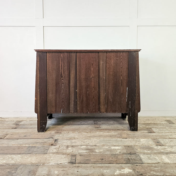 Four-drawer oak chest with traditional form

